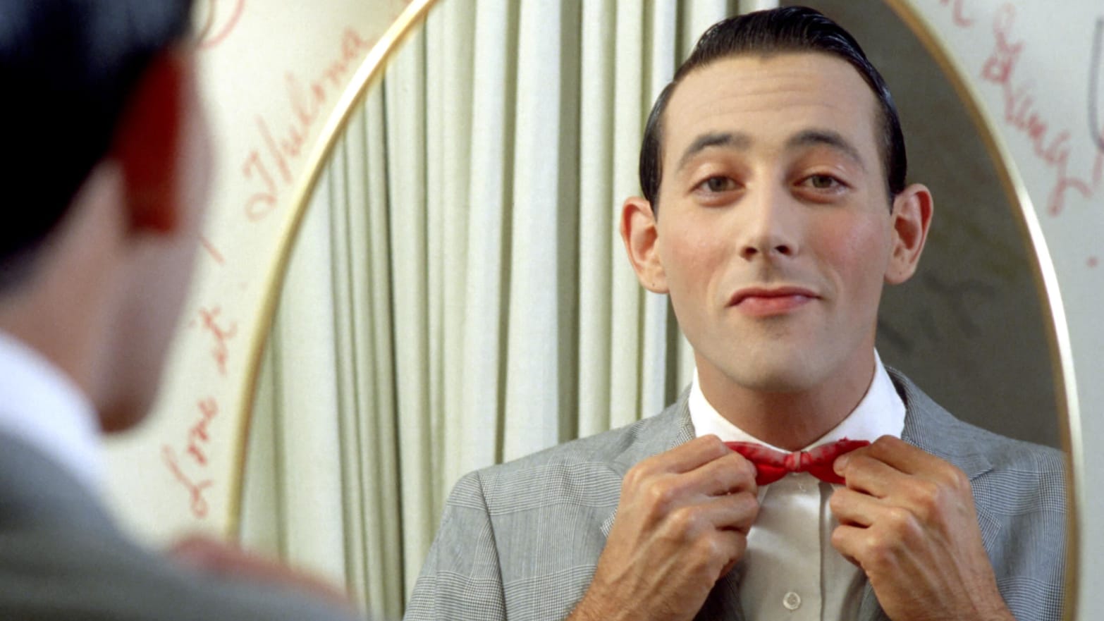 Actor Paul Reubens poses for a portrait dressed as his character Pee-wee Herman in May 1980.