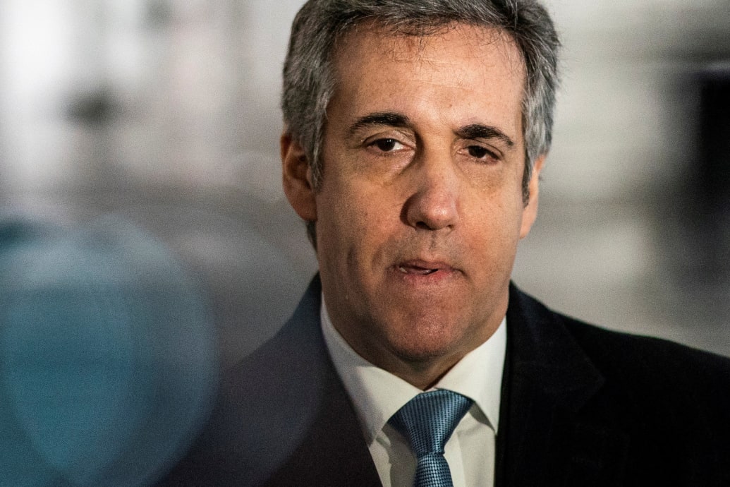 Michael Cohen, wearing a suit and tie, photographed while speaking.