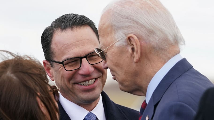 U.S. President Joe Biden is greeted by Governor Josh Shapiro upon arrival in Philadelphia, Pennsylvania, U.S., December 11, 2023. 