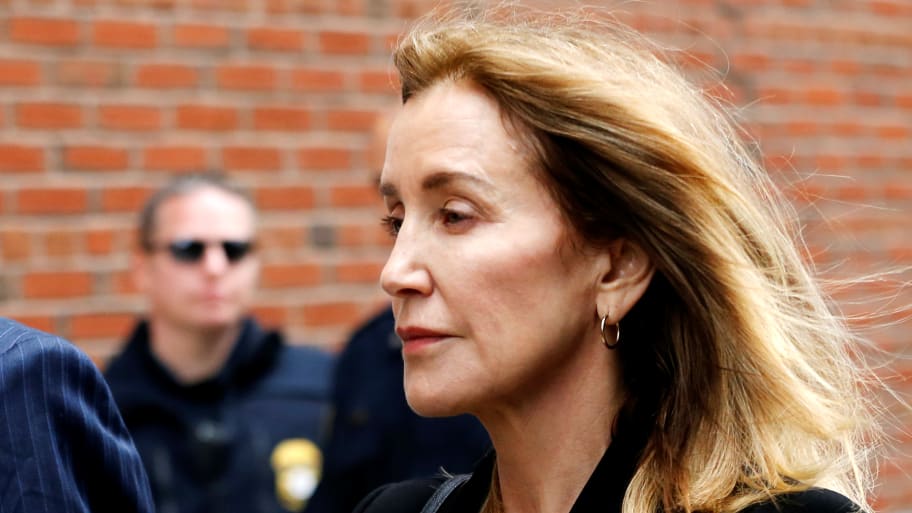 Actor Felicity Huffman arrives at the federal courthouse to face charges in a nationwide college admissions cheating scheme in Boston, Massachusetts