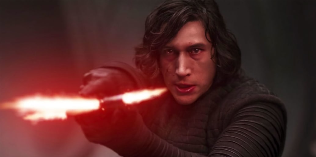 Adam Driver holds a lightsaber in a still from 'Star Wars: Rise of the Skywalker'