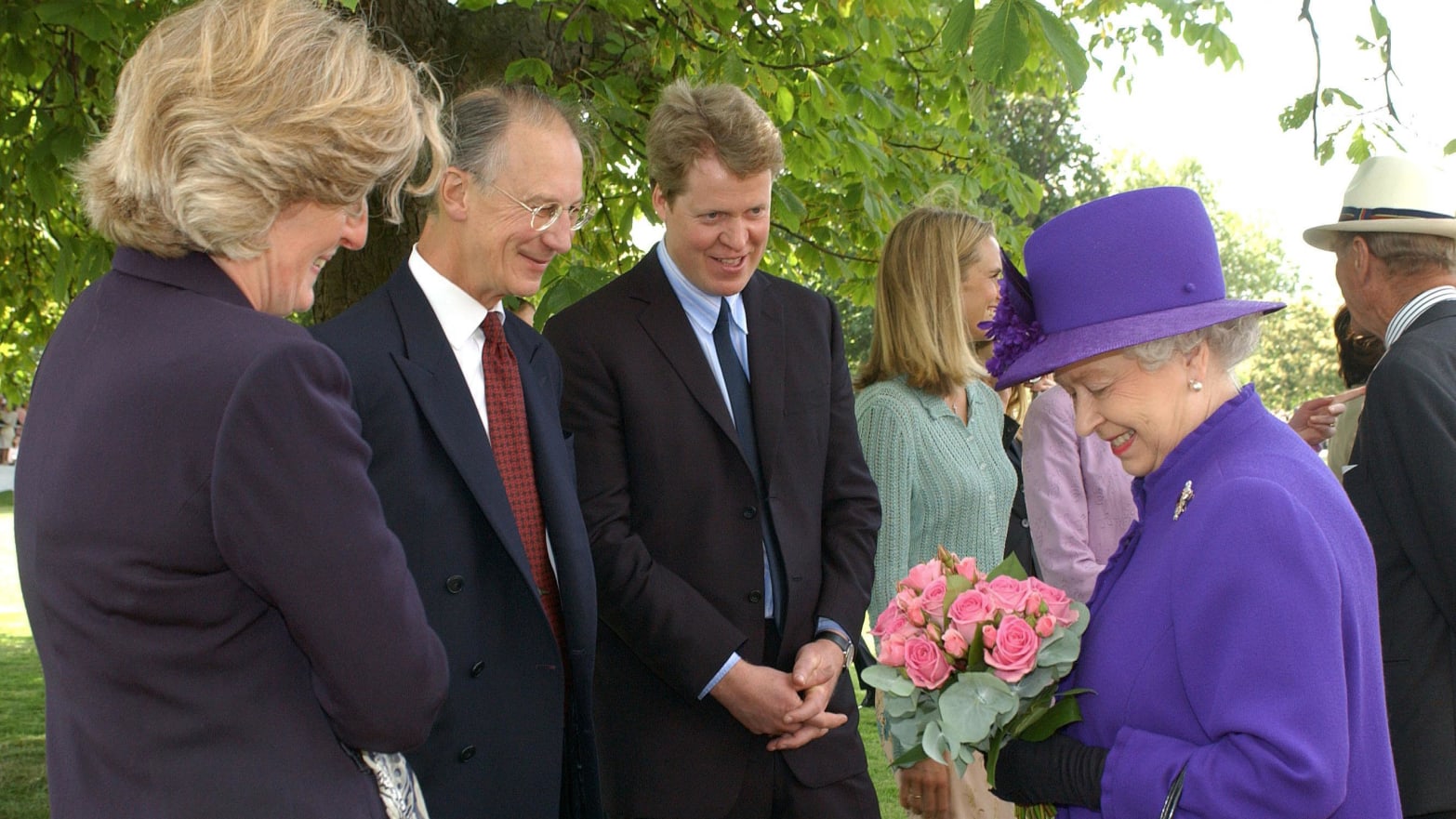 Britain's Queen Elizabeth II (right), Charles Spencer (center) together with Robert and Jane Fellowes in August 1997.   