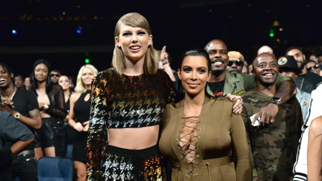 Photo of Taylor Swift and Kim Kardashian West attending the 2015 MTV Video Music Awards 