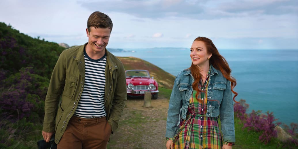 Ed Speelers and Lindsay Lohan walk together in a still from ‘Irish Wish’