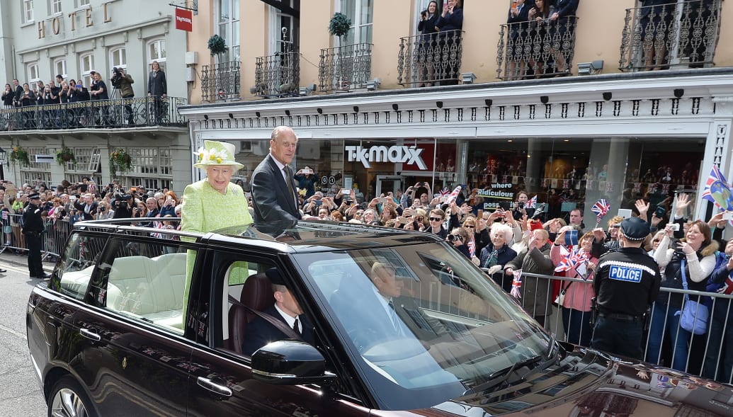Britain's Queen Elizabeth is driven through Windsor in an open-top Range Rover with Prince Philip on her 90th Birthday, in Windsor, Britain April 21, 2016.