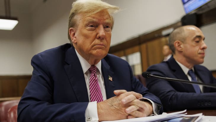 Former U.S. President Donald Trump sits at the defendant's table during his criminal trial