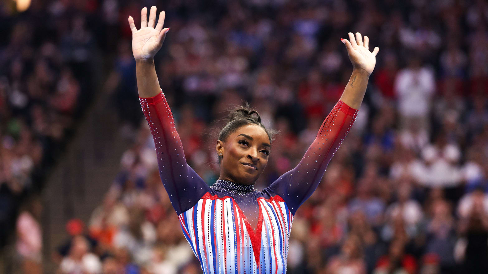 Simone Biles celebrates her floor routine during the U.S. Olympic Team Gymnastics Trials at Target Center. 