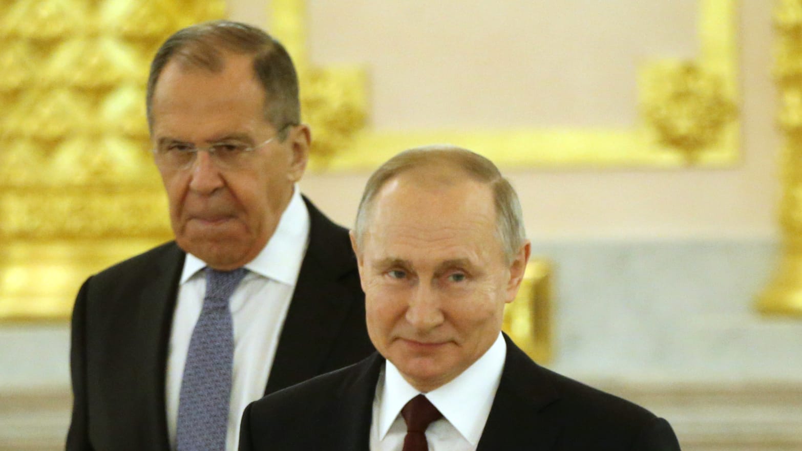 Russian President Vladimir Putin (R) and Russian Foreign Ministers Sergei Lavrov (L)