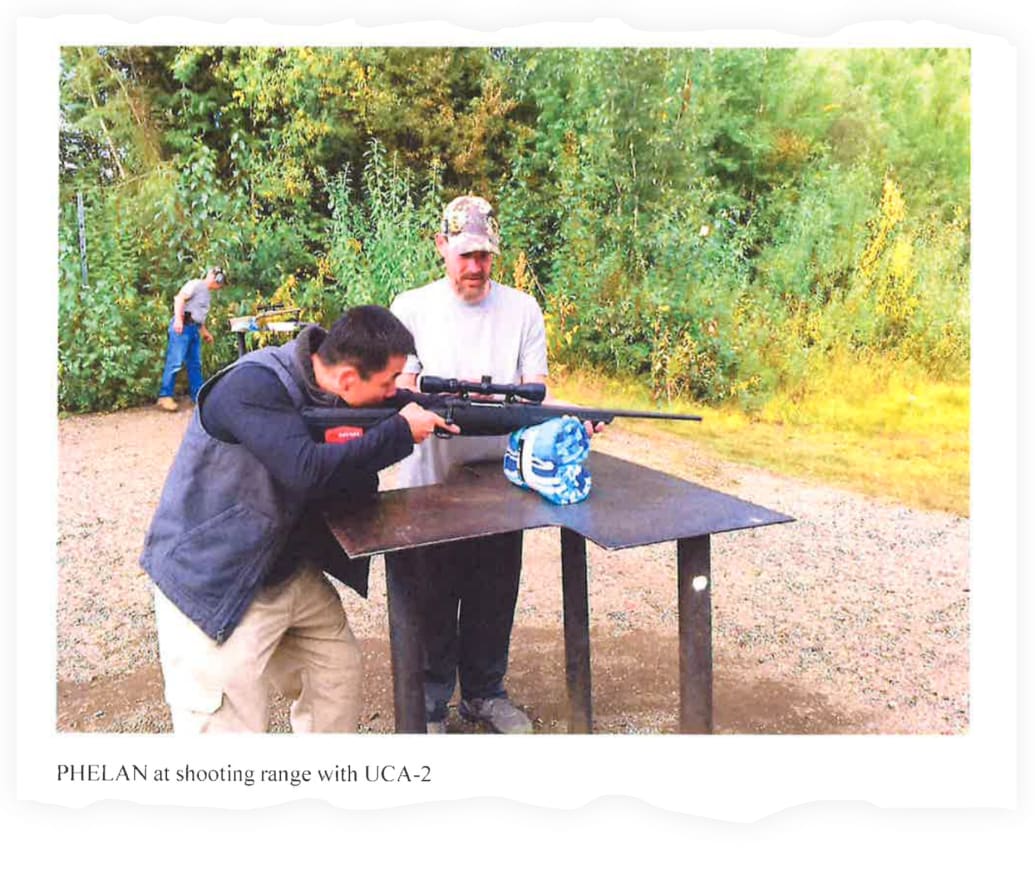 An undercover HSI agent with Phelan at a shooting range in Alaska.