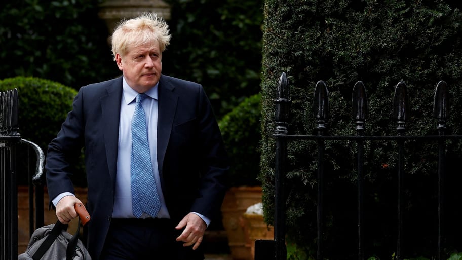 Former British Prime Minister Boris Johnson walks outside his home, in London, Britain, March 22, 2023.