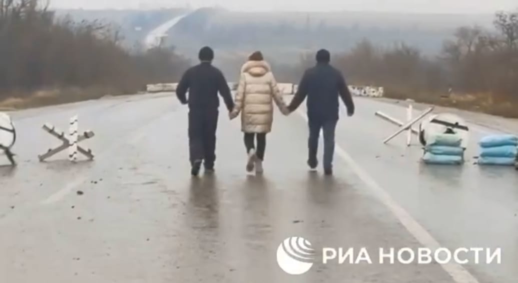 A screengrab of another video of Yahupova and the two other men were forced to film, shown being "released" from a Russian labor camp. 