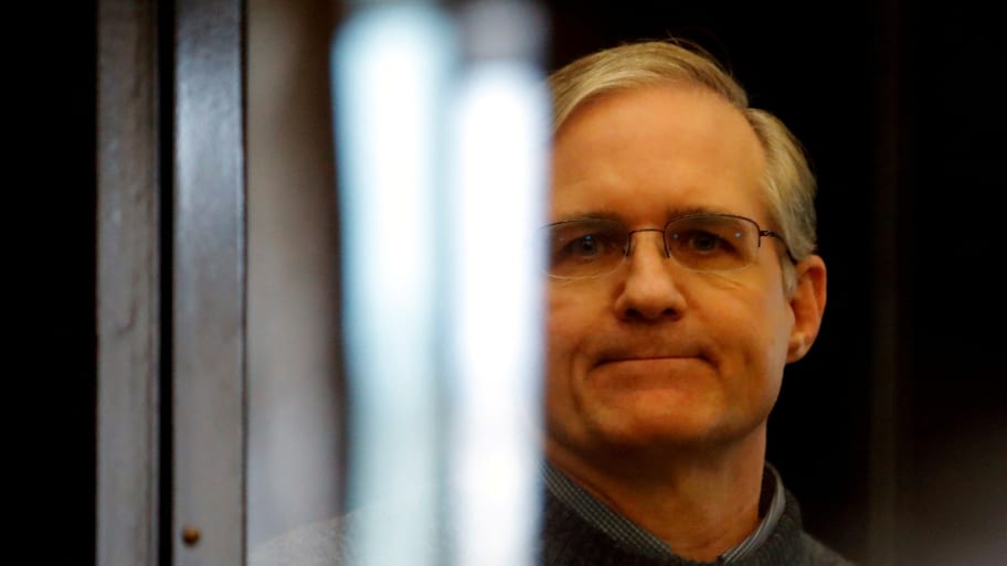 Former U.S. Marine Paul Whelan, who was detained and accused of espionage, stands inside a defendants' cage during his verdict hearing in Moscow.