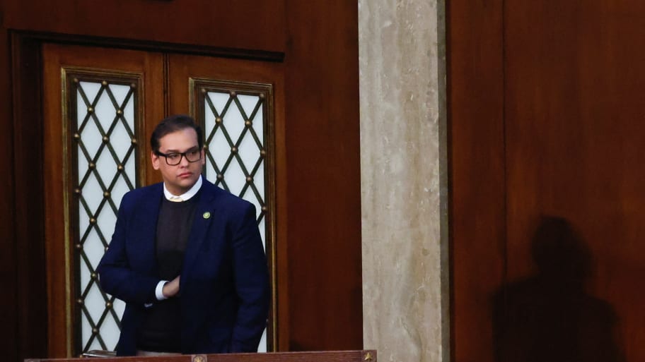 George Santos stands alone on the floor of the U.S. House of Representatives