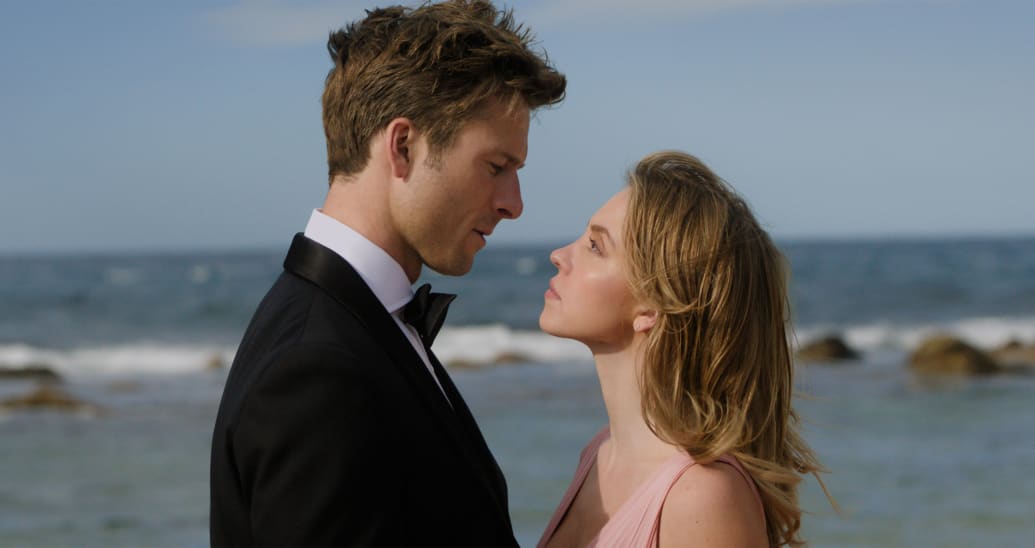 Glen Powell and Sydney Sweeney hug in a still from 'Anyone But You'