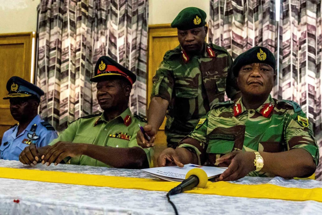 Zimbabwe Army General Constantino Chiwenga and Valerio Sibanda, commander of the Zimbabwe National Army (2L), address a media conference held at the Zimbabwean Army Headquarters on Nov. 13, 2017, in Harare.