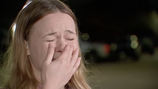 Carissa Davis fights back tears in a local news interview.
