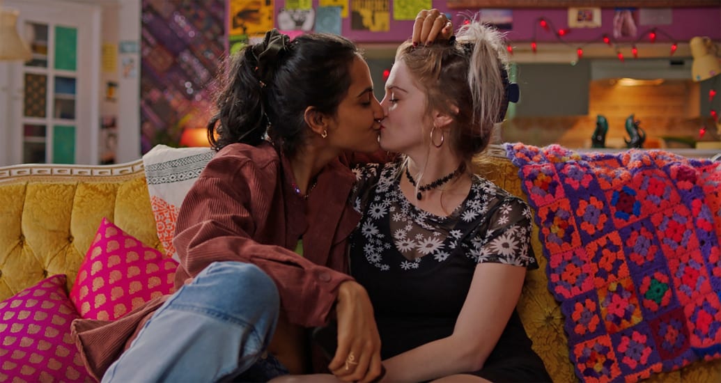 Amrit Kaur and Kya Mosey kiss in a still from 'The Queen of My Dreams'