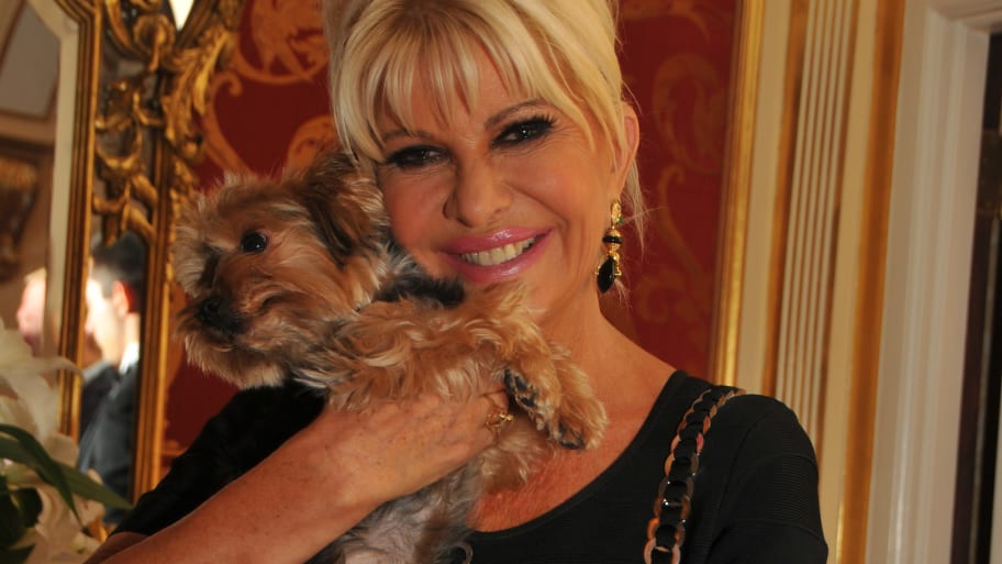 Ivana Trump, ex-wife of mogul Donald Trump, celebrates at a party with her dog to introduce her brand of wine to her society friends