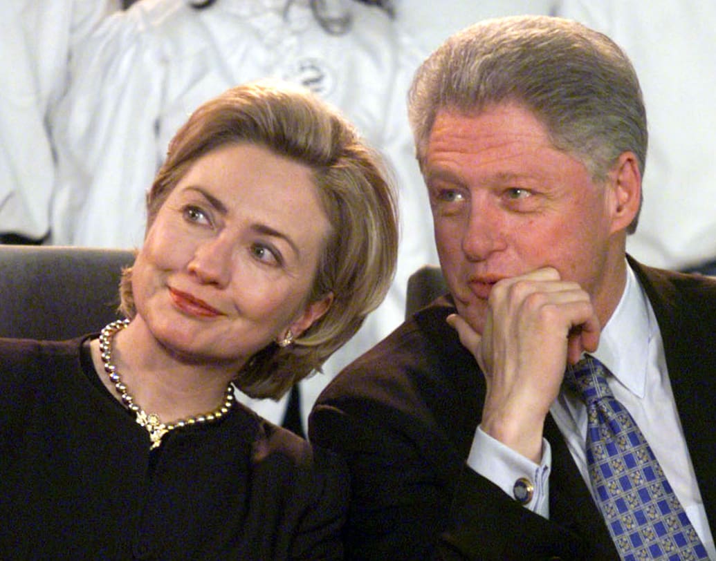 Bill and Hillary Clinton during a candle-lighting ceremony in 1998.