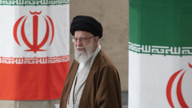 Iranian Supreme Leader Ayatollah Ali Khamenei arrives to vote for the parliamentary runoff elections. 
