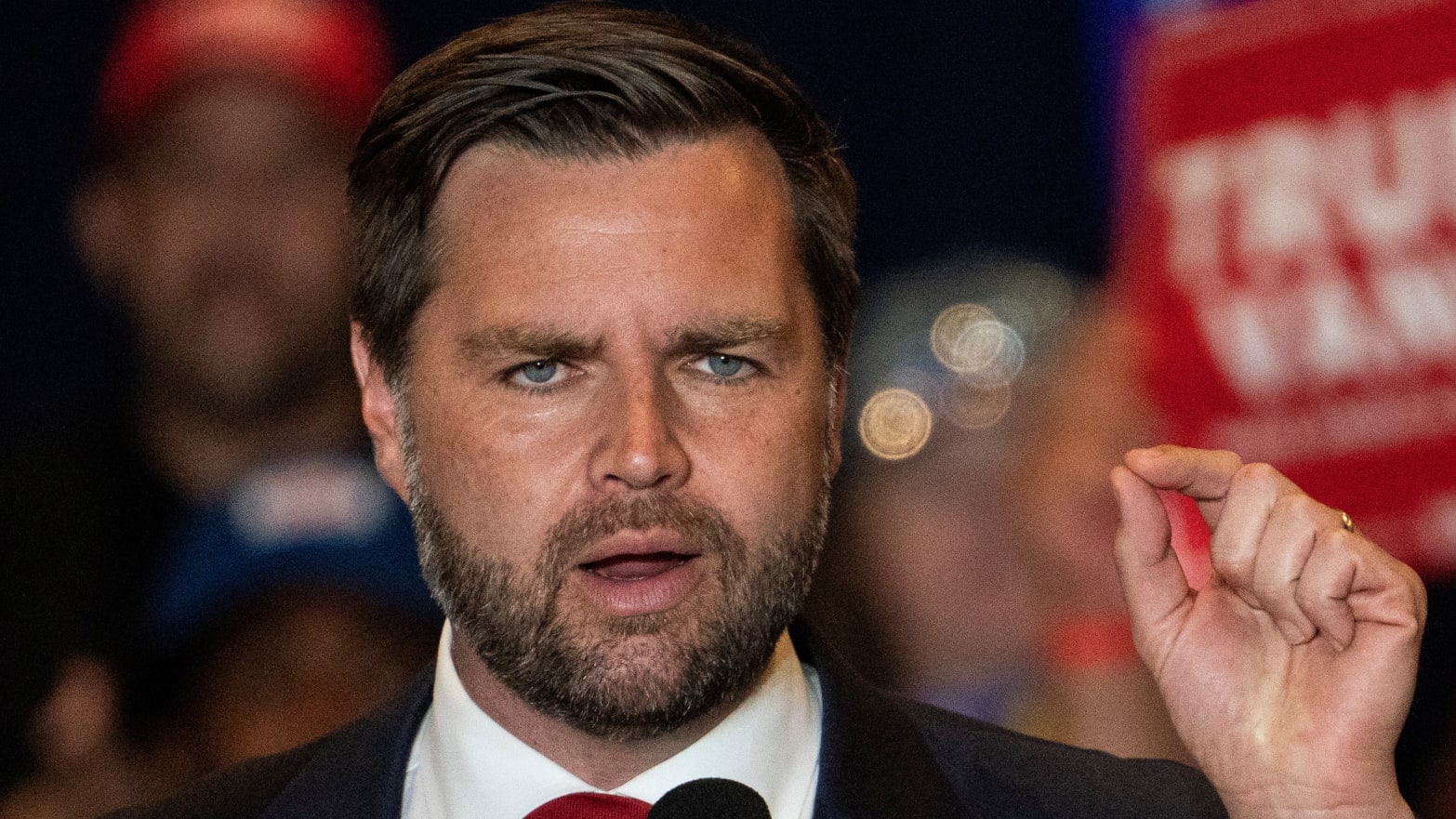 JD Vance speaks on stage during a campaign event.