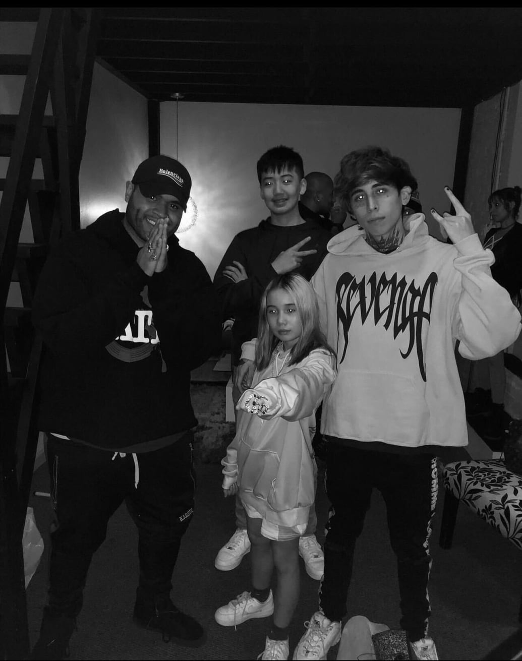 Lil Tay, center, her brother, Jason Tian, background, and their musical collaborator, Diablo, right, after a studio session.