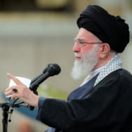 Iran's Supreme Leader Ayatollah Ali Khamenei points his finger while speaking.