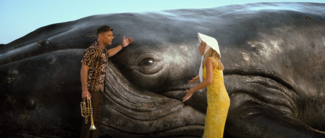 A photo of Ricky Martin and Kristen Wiig with a whale in Palm Royale