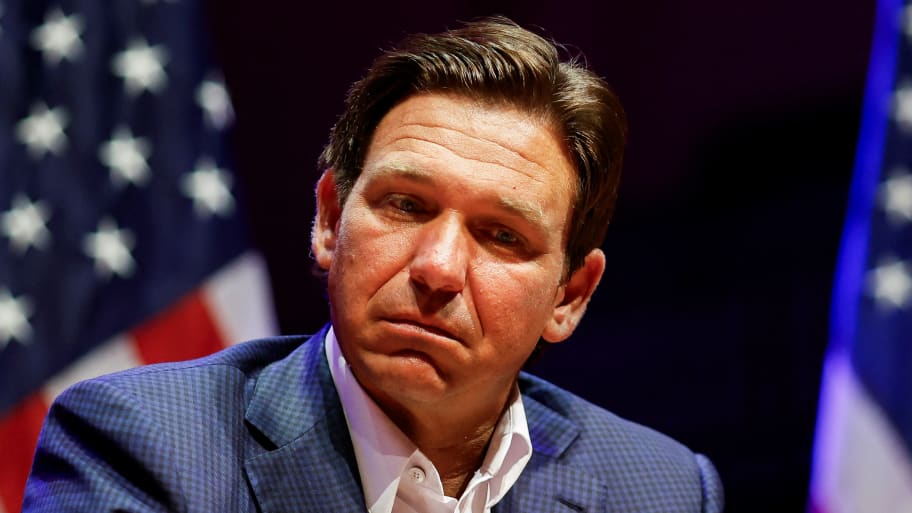 Ron DeSantis stares down while on stage at an event.