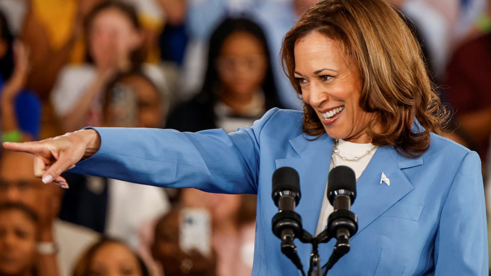  Kamala Harris gestures as she speaks at an event at the Hendrick Center for Automotive Excellence in Raleigh, NC.