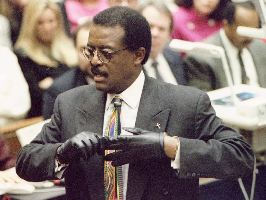 Johnnie Cochran tries on a pair of gloves during closing arguments of O.J. Simpson’s infamous trial.