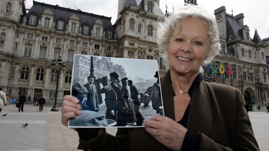 Francoise Bornet, with “The Kiss at City Hall” photograph by Robert Doisneau.