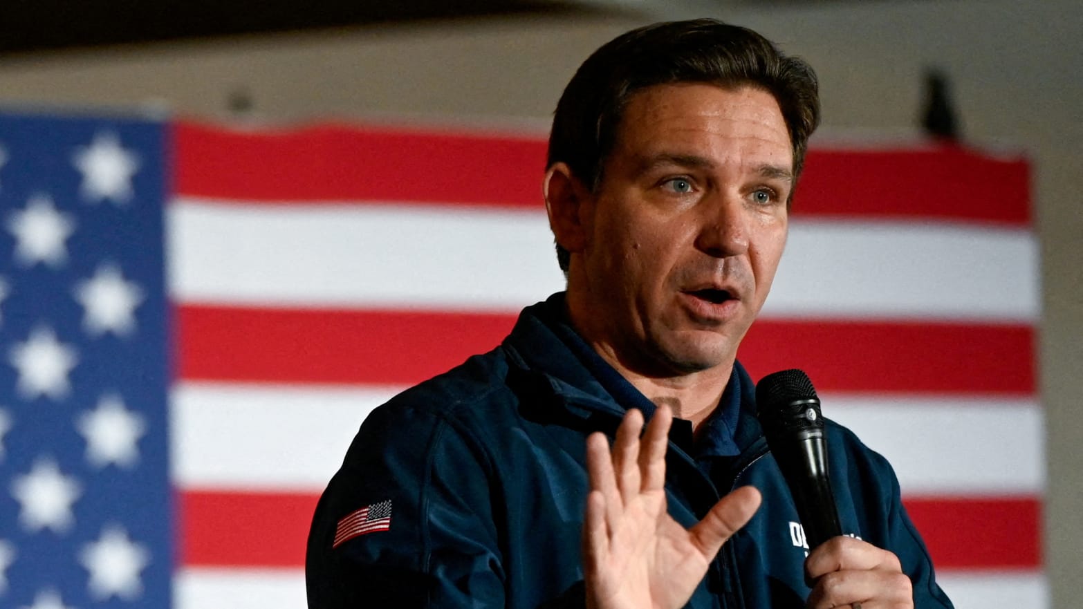 Ron DeSantis gestures as he speaks at a campaign event at The Thunderdome in Newton, Iowa
