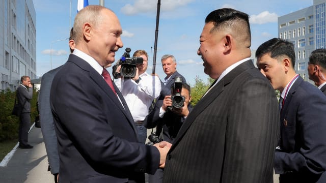 North Korean leader Kim Jong Un shakes hands with Russia's President Vladimir Putin