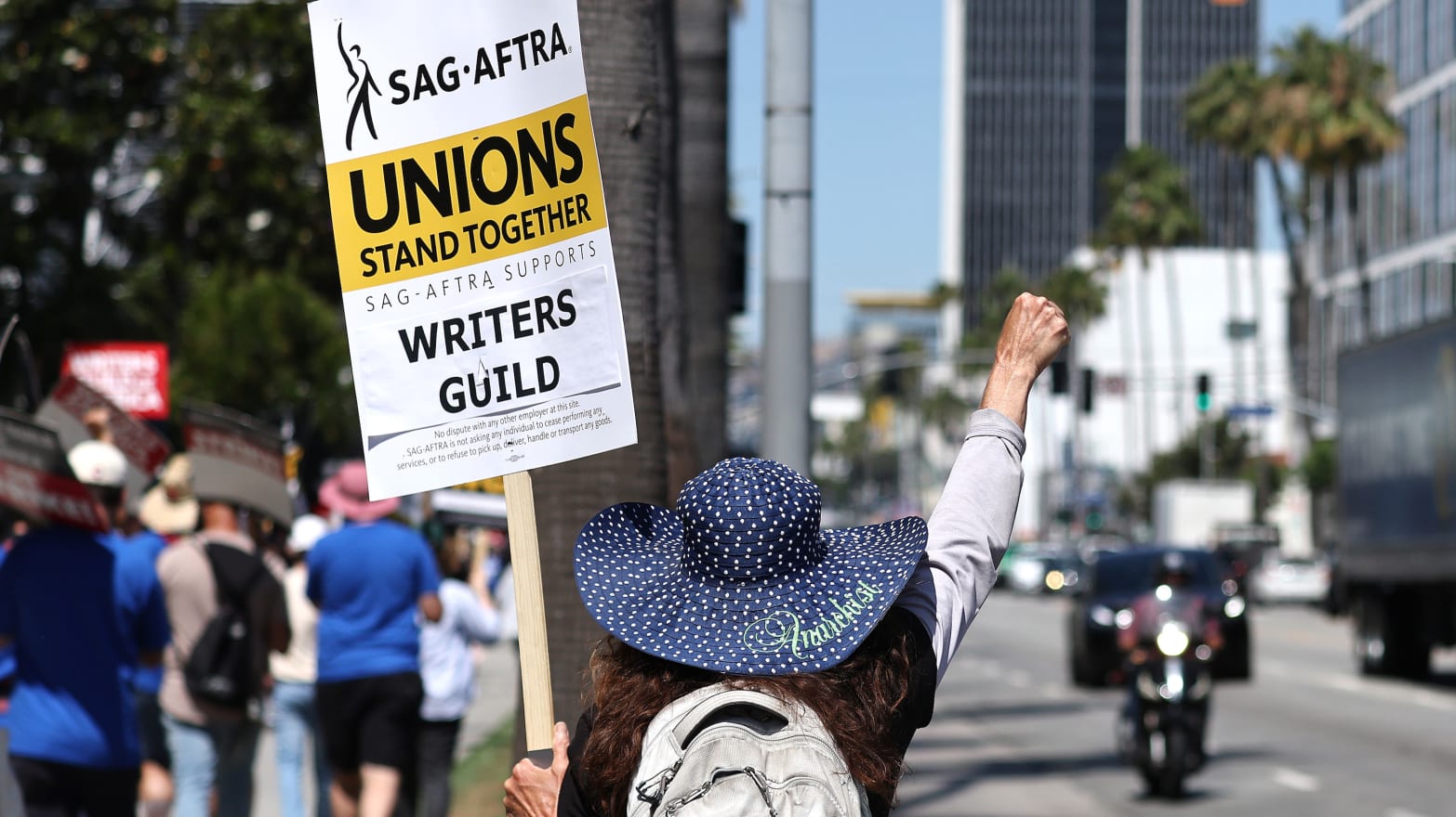 SAG-AFTRA members walk the picket line in solidarity with striking WGA workers.