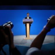 Britain's Prime Minister Rishi Sunak addresses delegates at the annual Conservative Party Conference in Manchester on October 4, 2023. 