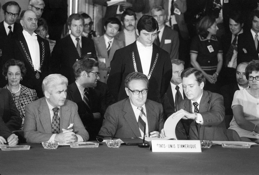 Henry Kissinger in Paris on Jan. 27, 1973, signing a cease-fire agreement bringing the Vietnam War to an end.