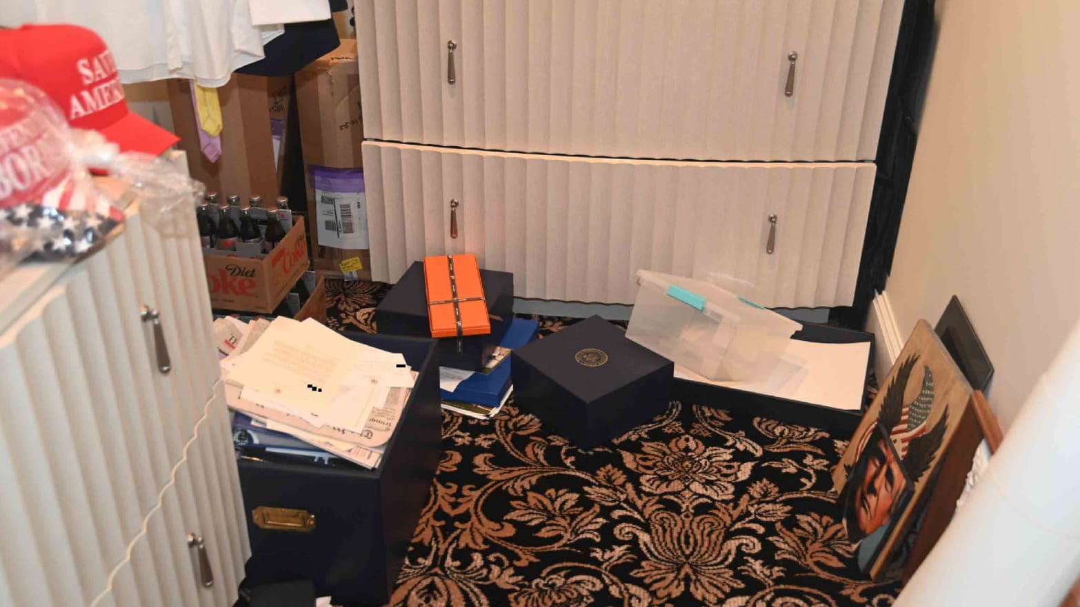 A photo of an unsecured box, allegedly containing sensitive U.S. secrets, at Mar-a-Lago.