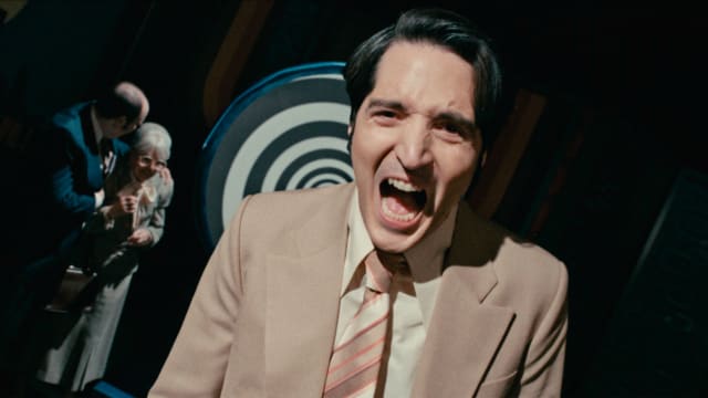 A photo still of David Dastmalchian in Colin Cairnes and Cameron Cairnes’ LATE NIGHT WITH THE DEVIL.