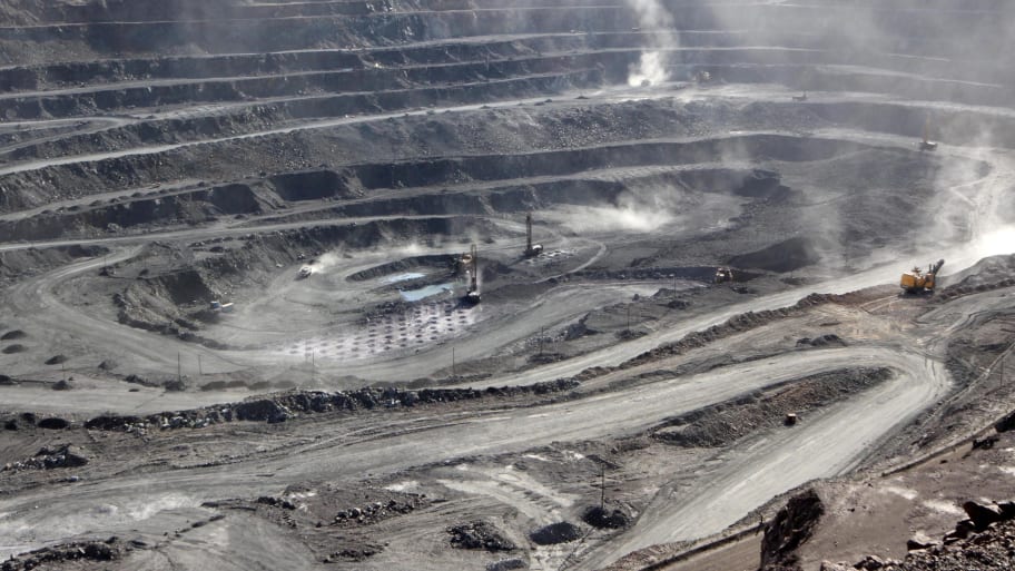 Miners are seen at the Bayan Obo mine containing rare earth minerals, in Inner Mongolia, China July 16, 2011.