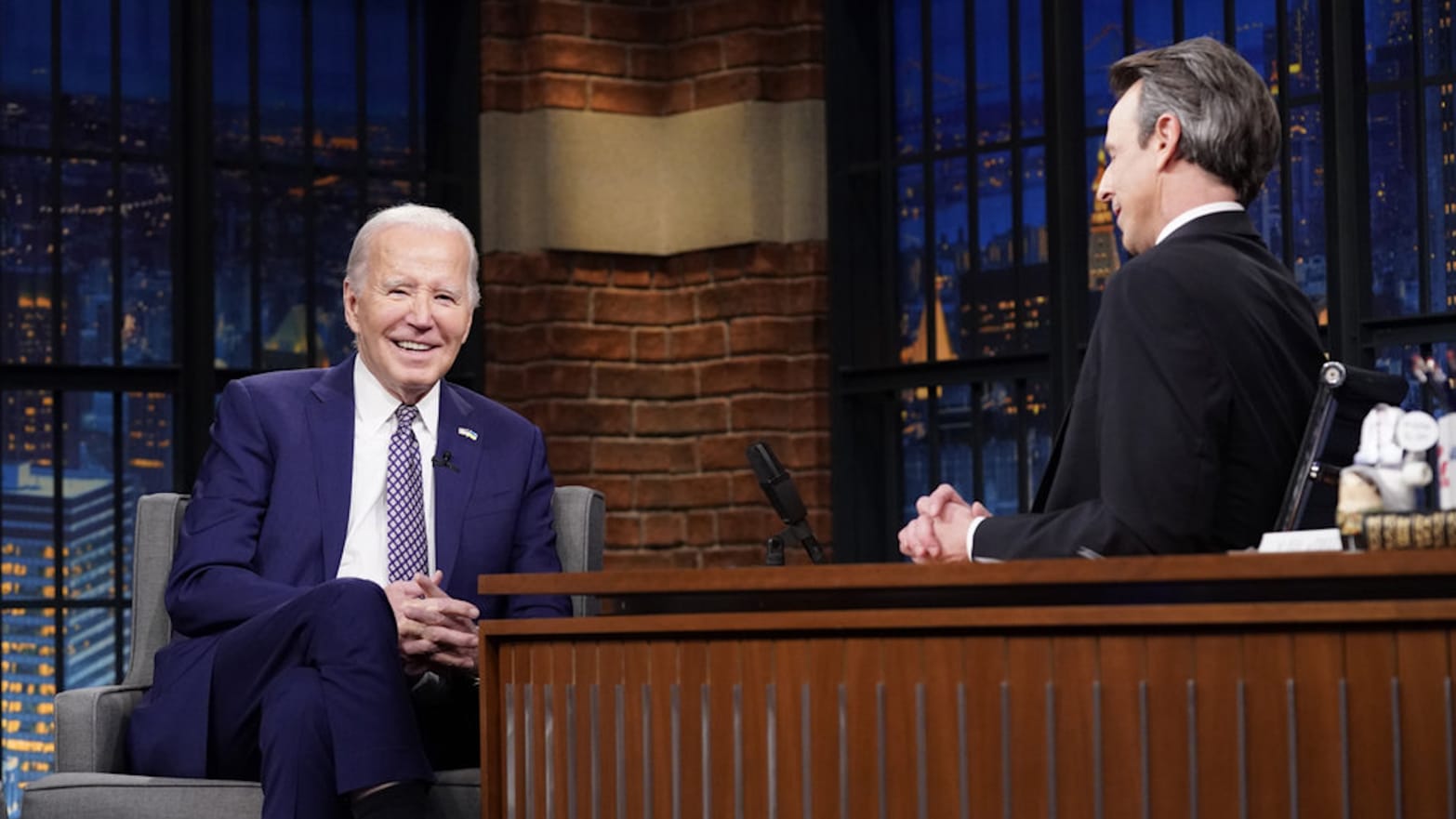 President Joe Biden talks with host Seth Meyers