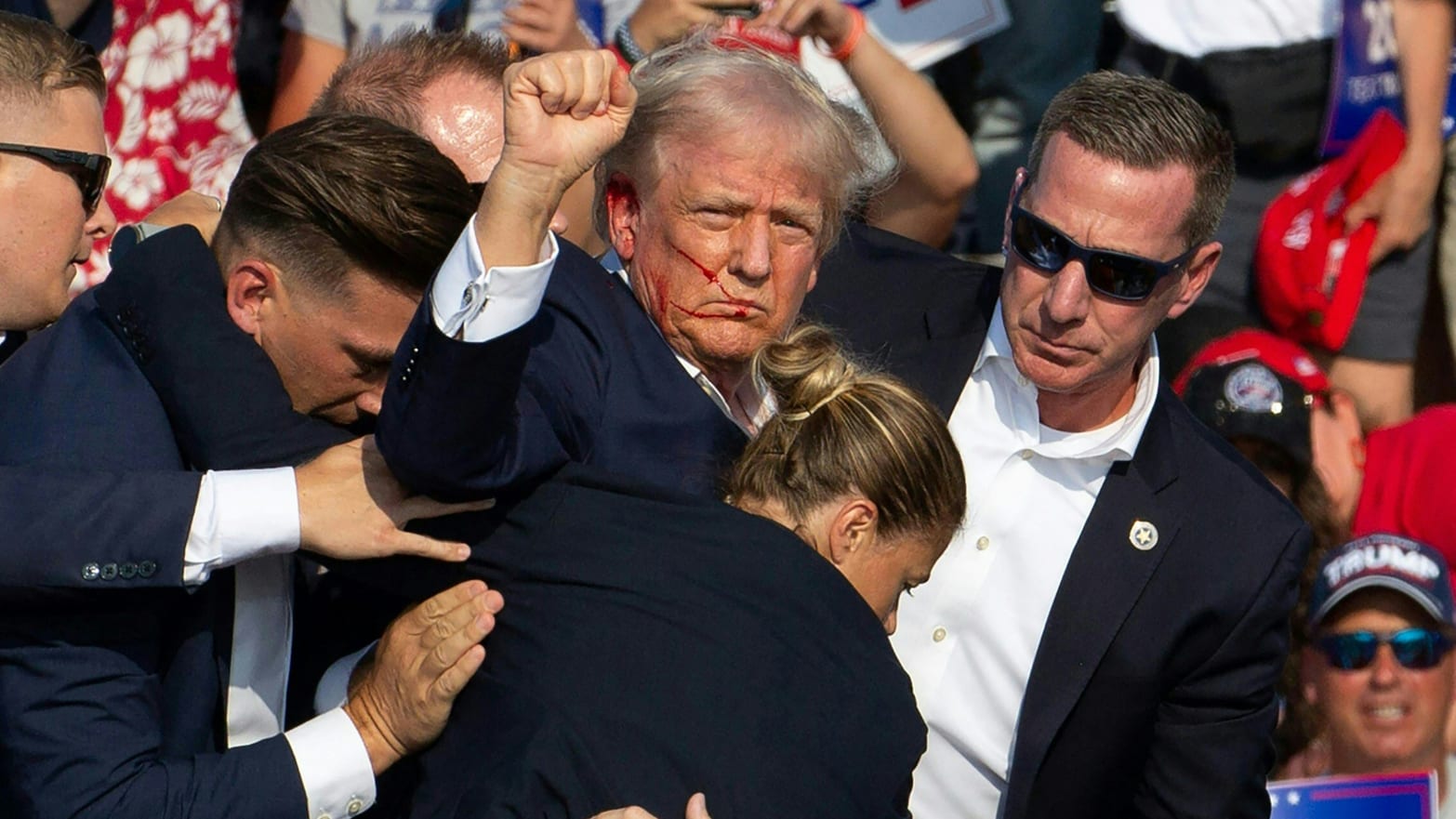 Republican candidate Donald Trump is seen with blood on his face