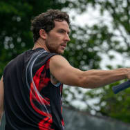 Josh O'Connor holds a racket in a still from 'Challengers'