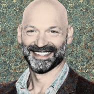 Photo illustration of Corey Stoll on a marble paper background