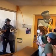 Protesters occupying Siemens Hall at Cal Poly Humboldt clash with police in riot gear who attempt to enter the building, on Monday Apirl 22, 2024. 