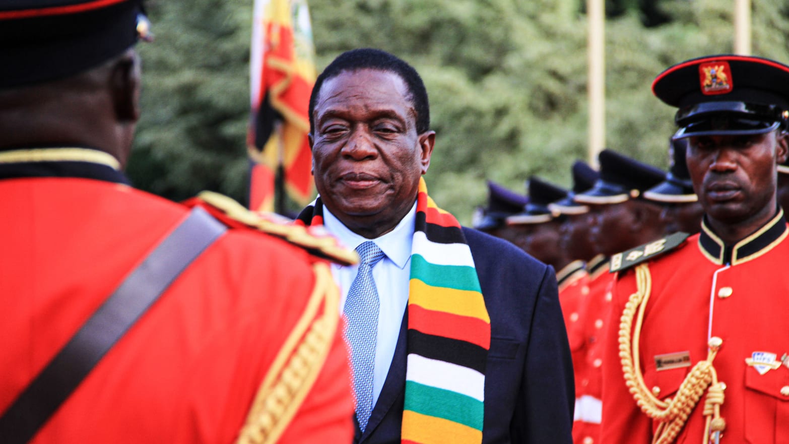 Zimbabwe's president Emmerson Mnangagwa (2nd L) reviews a guard of honour at the state house during his official visit to attend Uganda's 57th independence day in Entebbe, Uganda, on October 8, 2019