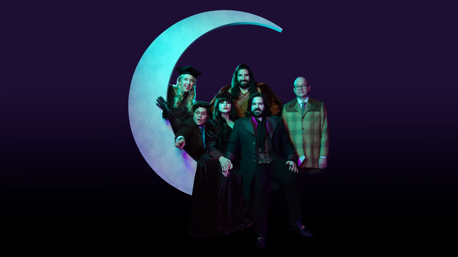 An image of the cast of What We Do in the Shadows sitting on a moon