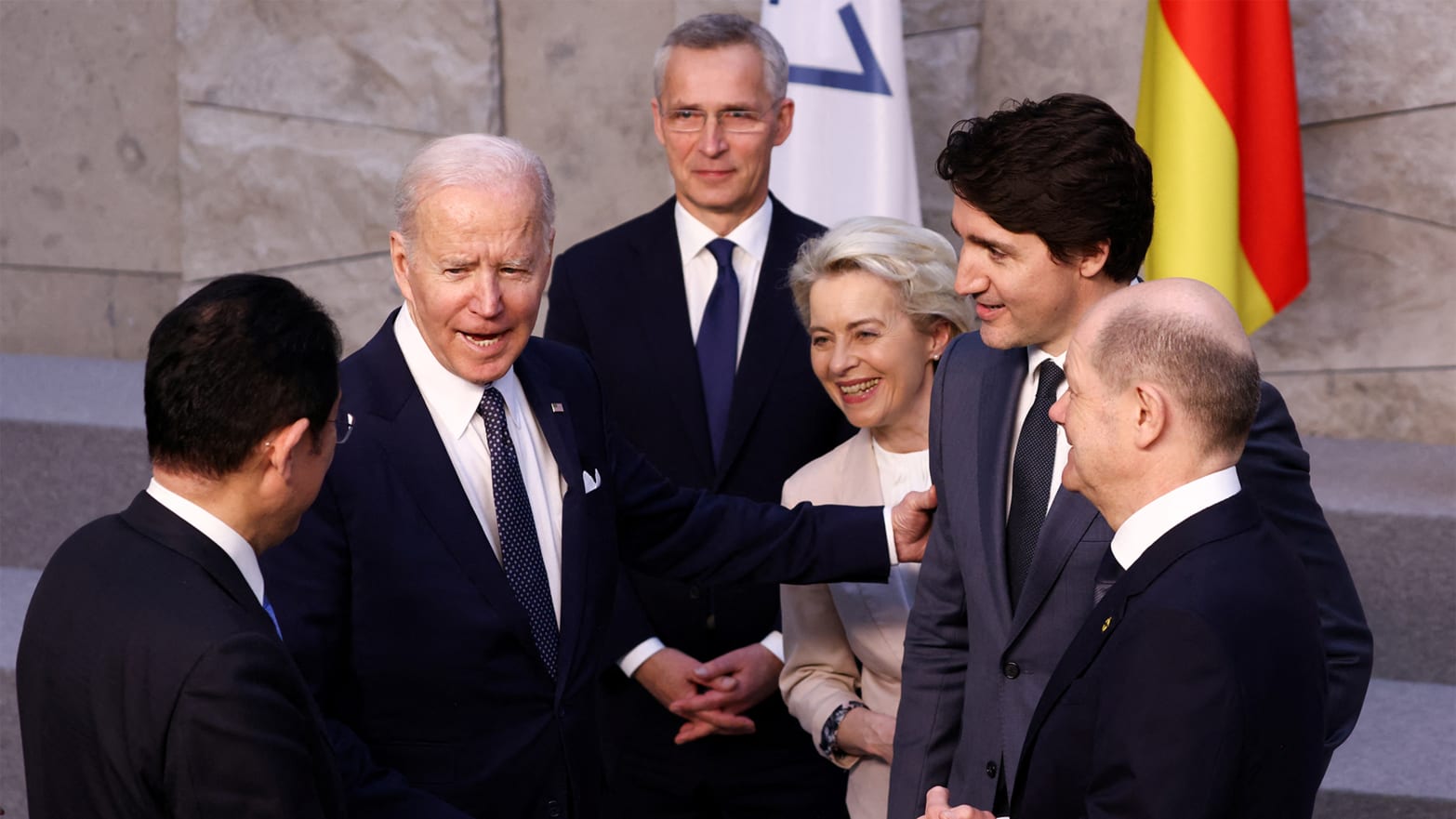A photo of President Joe Biden meeting with world leaders during the 2022 NATO summit in Belgium.