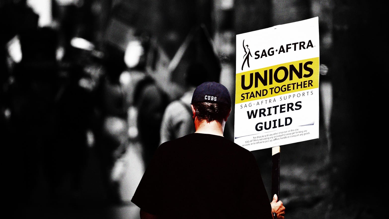 An illustration including a  SAG-AFTRA member holding a sign that reads Unions Stand Together during WGA Strike.