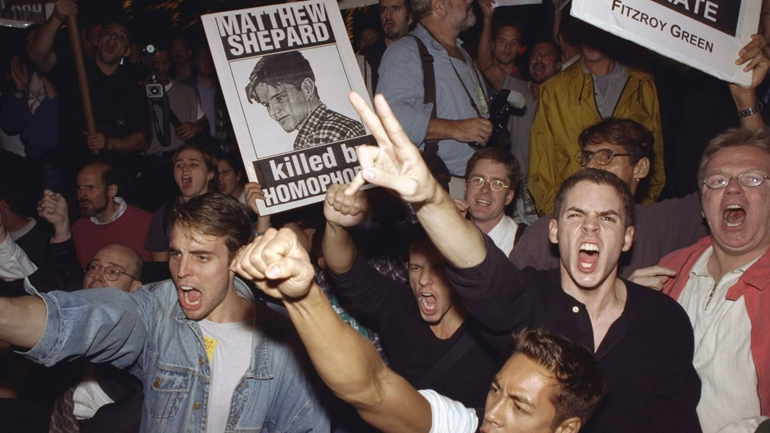 Demonstrators protest the killing of Matthew Shepard